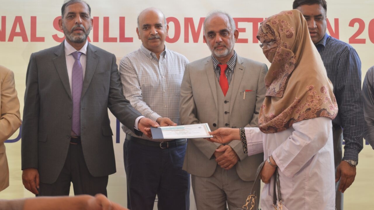 Our Beautician Rabail Thebo Recieving 1st position cash award from DG NAVTTC Raheem Bux Shaikh Sindh in Zonal Competition arranged by NAVTTC