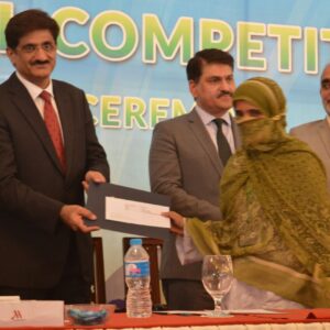 Our Dress making student Haseena Recieving 1st position cash award from Chief Minister Sindh in Provincial Competition arranged by NAVTTC-1