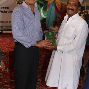 SSP Shabir Ahmed Sethar Recieving Shield from Founder ACD HAji Qurban Ali khooharo